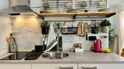 a kitchen with a sink and a counter top at Mali Raj in Mengeš