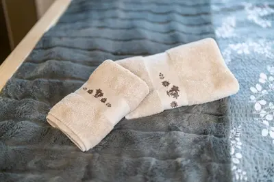 a pair of socks with dog paws on a bed at Studio Barbara in Bohinj
