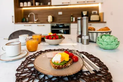 a table with a plate of food on a counter at Apartma 21 - Ajda in Bovec