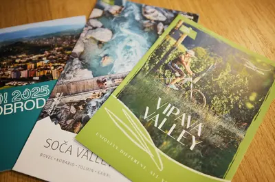 two books sitting on top of each other on a table at VIPAVA river house in Vipava