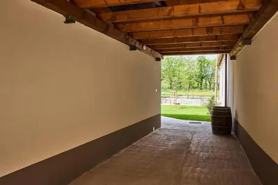 an empty hallway of a house with a wooden ceiling at VIPAVA river house in Vipava