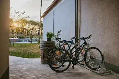 a group of bikes parked next to a building at VIPAVA river house in Vipava