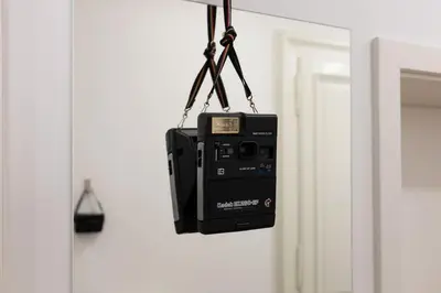 a tv hanging on a wall next to a door at Spacious Apartment in Historic Centre & FREE Parking in Ljubljana