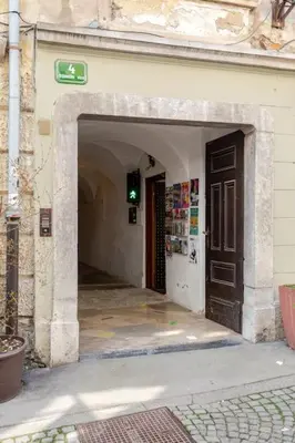an entryway to a building with a black door at Artistic Studio Quiet Crusader Street Apartment in Ljubljana