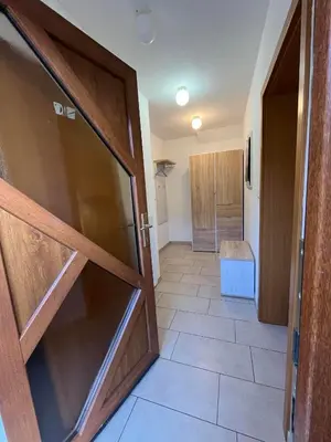a door leading into a hallway with a bathroom at Sončni zahod in Kobarid