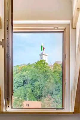 a window with a view of a lighthouse at Sofija's Central Apartments in Ljubljana