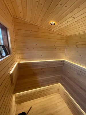 an empty sauna with a light in the middle at Relax house AVUS with Sauna in Slappe dʼIdria
