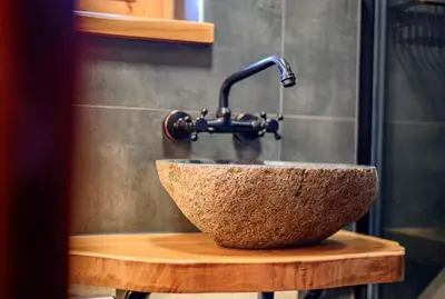 a bathroom sink with a faucet on top of it at Relax house AVUS with Sauna in Slappe dʼIdria