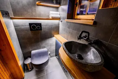 a bathroom with a sink and a toilet at Relax house AVUS with Sauna in Slappe dʼIdria