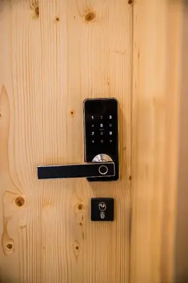 a wooden door with a black door knob on it at B&B Mio Nonno Rooms Ljubljana in Ljubljana