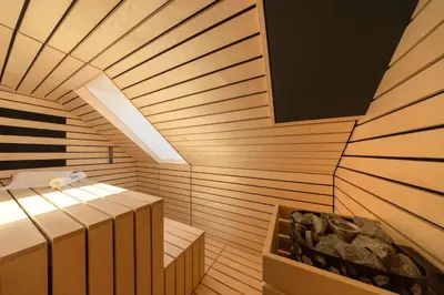 a room with a sauna with a tub in it at House Natura Triglav in Bohinj