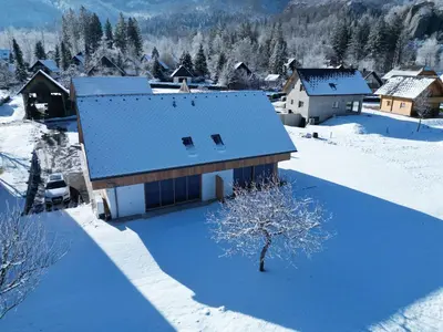 an aerial view of a house in the snow at House Natura Triglav in Bohinj