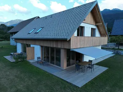 an overhead view of a house with a table and chairs at House Natura Triglav in Bohinj