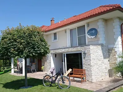 a bike parked in front of a house at Haloze ForMe in Zavrč