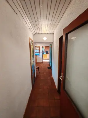a long hallway with a hallwayngthngthngthngthngthngthngthngthngthngth at Apartment Ursa Major in Preddvor