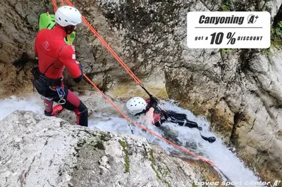 two people are on a rappelling course on a mountain at Glamping Virje in Bovec