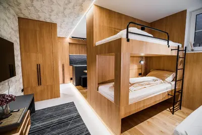 a bedroom with bunk beds in a room at Apartments Slavec with Free Onsite Parking in Kranjska Gora