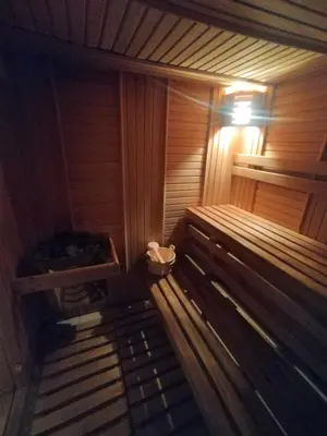 an empty sauna with a bench and a light at Počitniška hiša Lokve in Trnovo