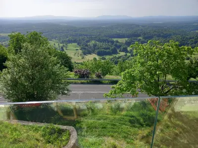 a view of a road from a glass window at Vineyard cottage foggy sea in Semič