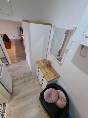 a view of a bathroom with a mirror and a stool at Oldie goldie in Maribor