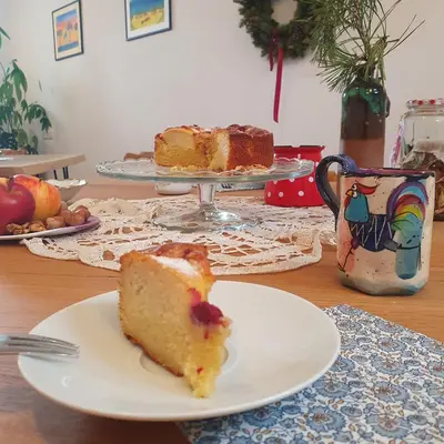 a piece of cake on a plate on a table at River House Radolca in Radovljica