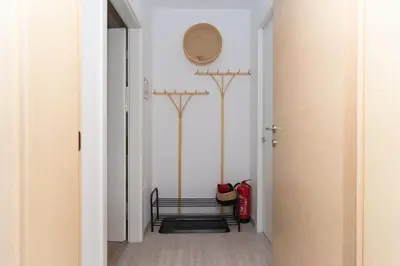 a hallway with a door leading into a room at Apartma Fantazija in Ribnica