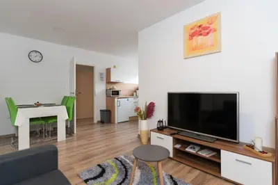a living room with a large flat screen tv at Apartma Fantazija in Ribnica
