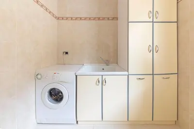 a laundry room with a washing machine and a sink at Apartments Way to Heaven in Dol pri Ljubljani