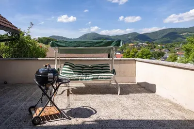 a chair on the roof of a house with a helmet at Premium house Anika in Rogaška Slatina