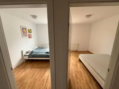a bedroom with a bed and a wooden floor at Dreamy nature apartment near city-family friendly, FREE parking in Ljubljana