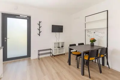 a dining room with a table and chairs at Apartma Lajf in Brežice