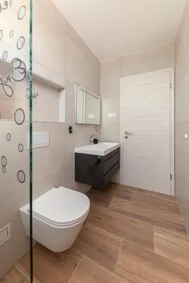 a bathroom with a toilet and a sink at Apartma Lajf in Brežice