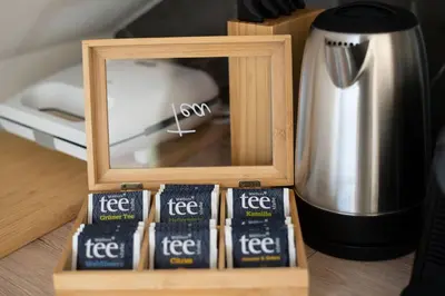 a wooden box with a picture of coffee packets at Forest Breeze Apartments in Blejska Dobrava