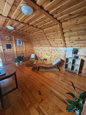 a large room with wooden walls and a wooden floor at TRUTH WINES HOUSE in Veliki Vrh