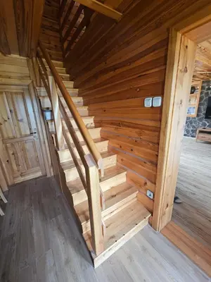 an overhead view of a wooden staircase in a cabin at TRUTH WINES HOUSE in Veliki Vrh