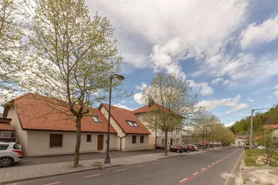a street with cars parked on the side of the road at Apartma pri Jakobu in Postojna