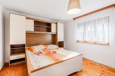 a bedroom with a bed in a room at Holiday Homes Pr Pelaku with Outdoor Sauna in Slappe dʼIdria
