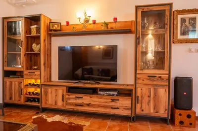 a large entertainment center with a television in a living room at Relax apartma Peter in Ptuj