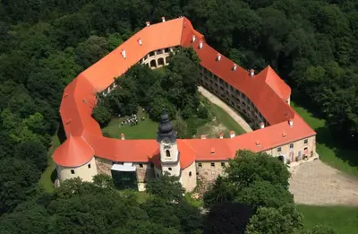 a large castle with an orange roof on a hill at Goričko view house in Križevci