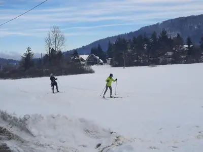 two people on skis in the snow at Cottage of peace, Ljubljana area in Rakitna