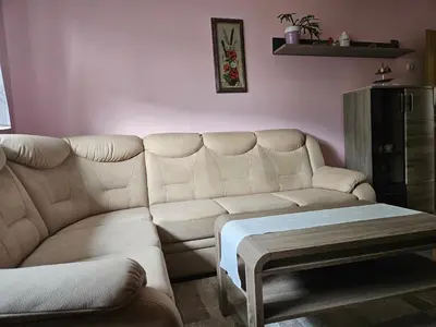 a living room with a couch and a table at Apartma Cipresa in Rogatec