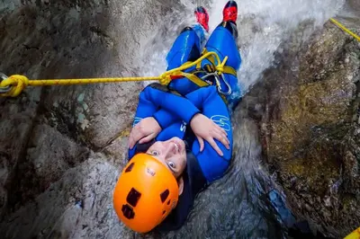 a young boy in a raft in a waterfall at Apartma Mirko in Bovec