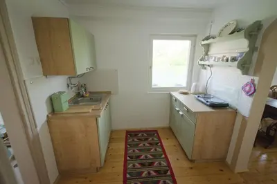a small kitchen with a sink and a counter at Vila Zora in Dobrna