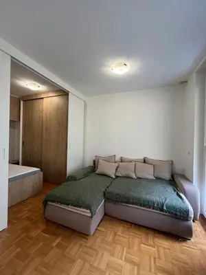 a bedroom with a bed in a room at Oasis Atrium Apartment with free parking in Ljubljana