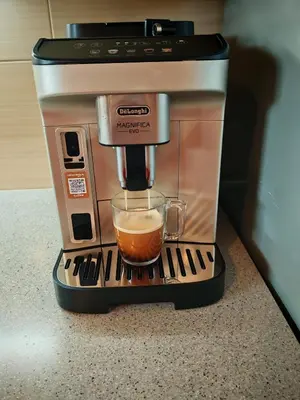 a coffee maker with a cup of coffee at Snoopy House in Žužemberk