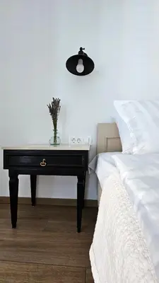 a bedroom with a black desk next to a bed at Apartment MoiRai in Gračišče