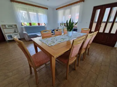 a dining room with a table and chairs at Apartma Mihatovi in Pivka