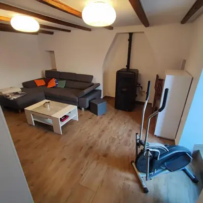 a living room with a couch and a table at Casa Rosmarin in Spodnje Škofije