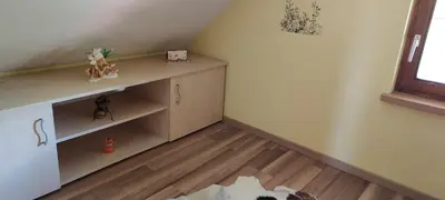 a corner of a room with a desk and a window at Hiška Tilia in Loče pri Poljčanah