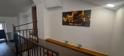 a staircase with a picture of a fire on the wall at Apartments Valdi in Tolmin